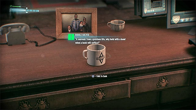 Officer Cashs desk - Riddles in GD Lockup | Collectibles - GD Lockup | Batman Arkham Knight - Collectibles - GD Lockup - Batman: Arkham Knight Game Guide & Walkthrough