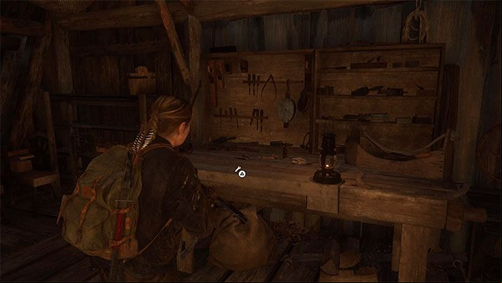 The Island stage A workbench table is located inside one of the huts of the cultists village - The Last of Us 2: Workbenches and weapons upgrades - Character development and equipment upgrades - The Last of Us 2 Guide